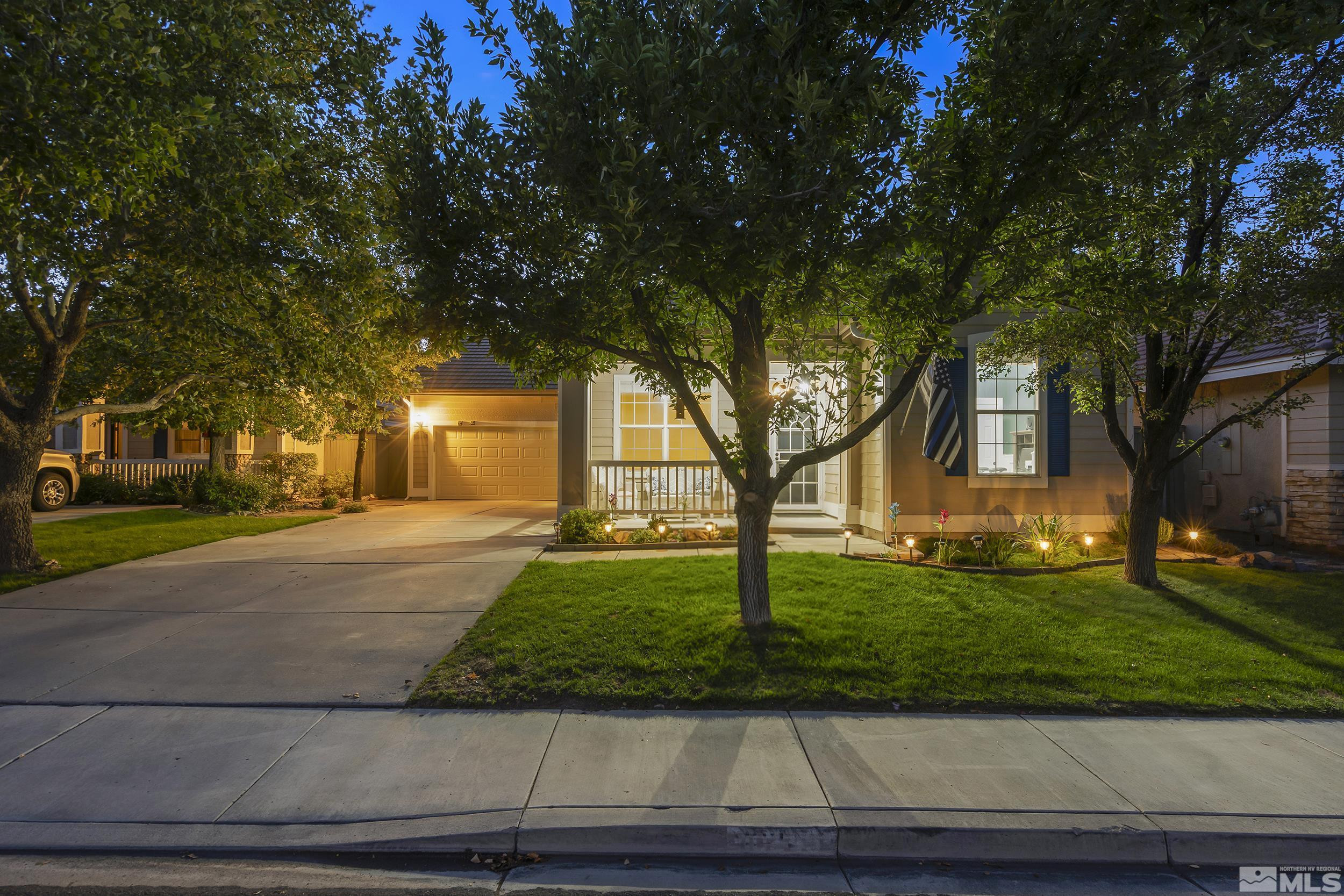 10245 Grizzly Hill Court Reno, NV 89521 - Photo 2 of 40 a front view of a house with a yard