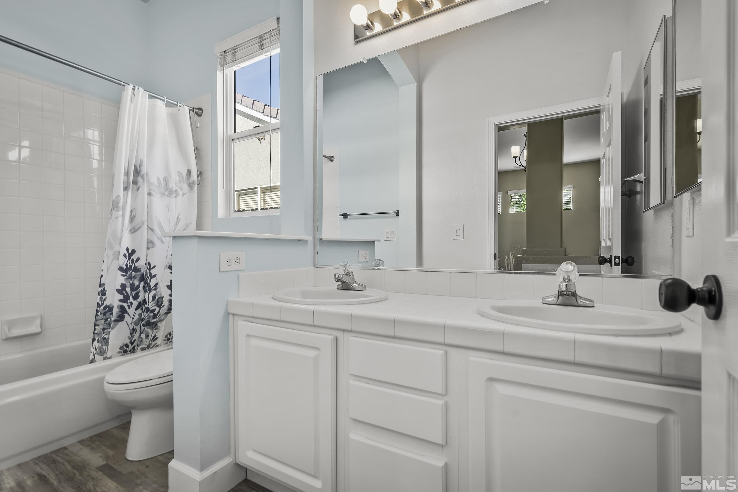 10245 Grizzly Hill Court Reno, NV 89521 - Photo 21 of 40 a bathroom with a sink toilet and shower