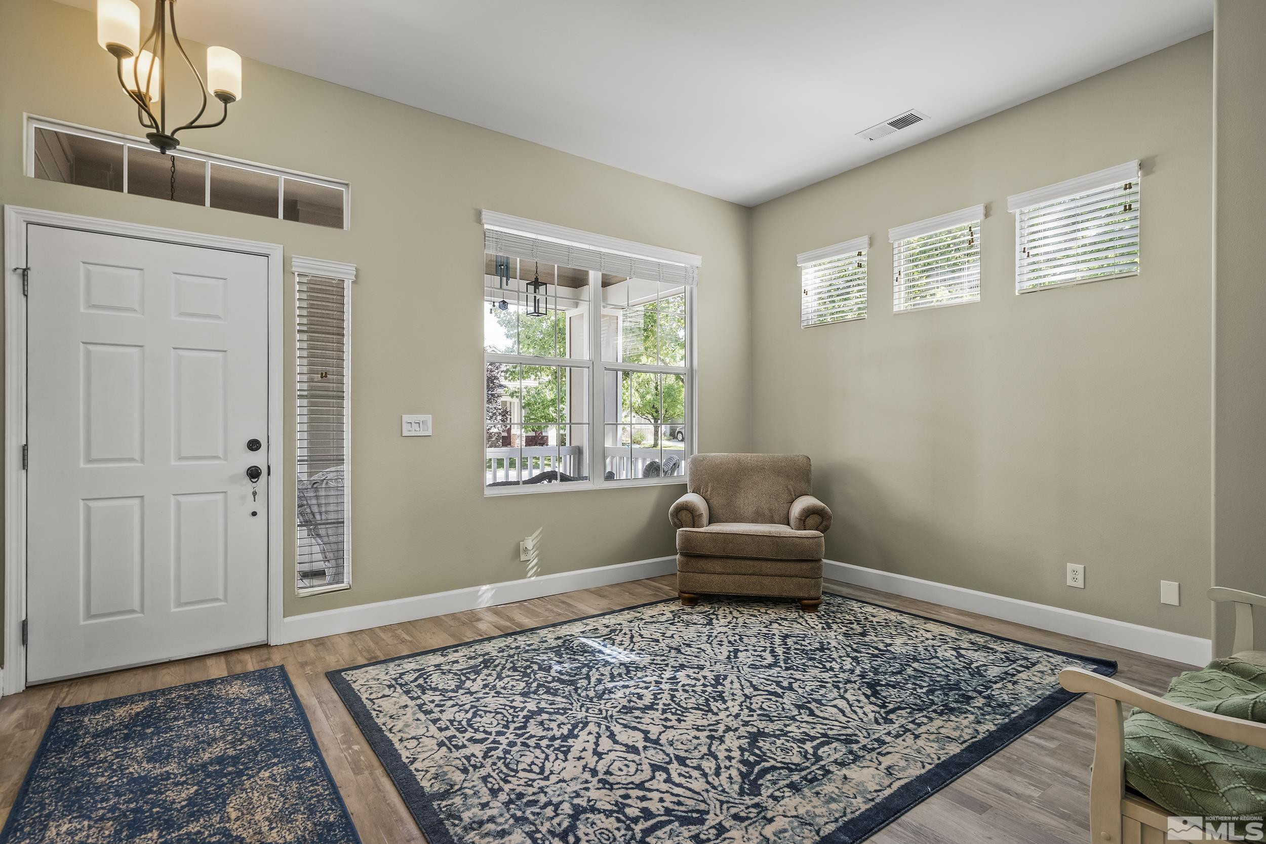 10245 Grizzly Hill Court Reno, NV 89521 - Photo 22 of 40 a living room with a couch and a rug