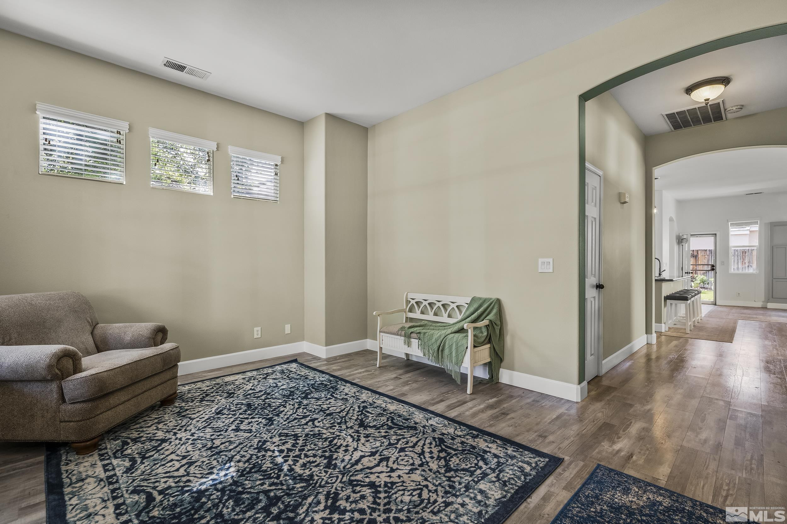 10245 Grizzly Hill Court Reno, NV 89521 - Photo 24 of 40 a living room with furniture and a rug