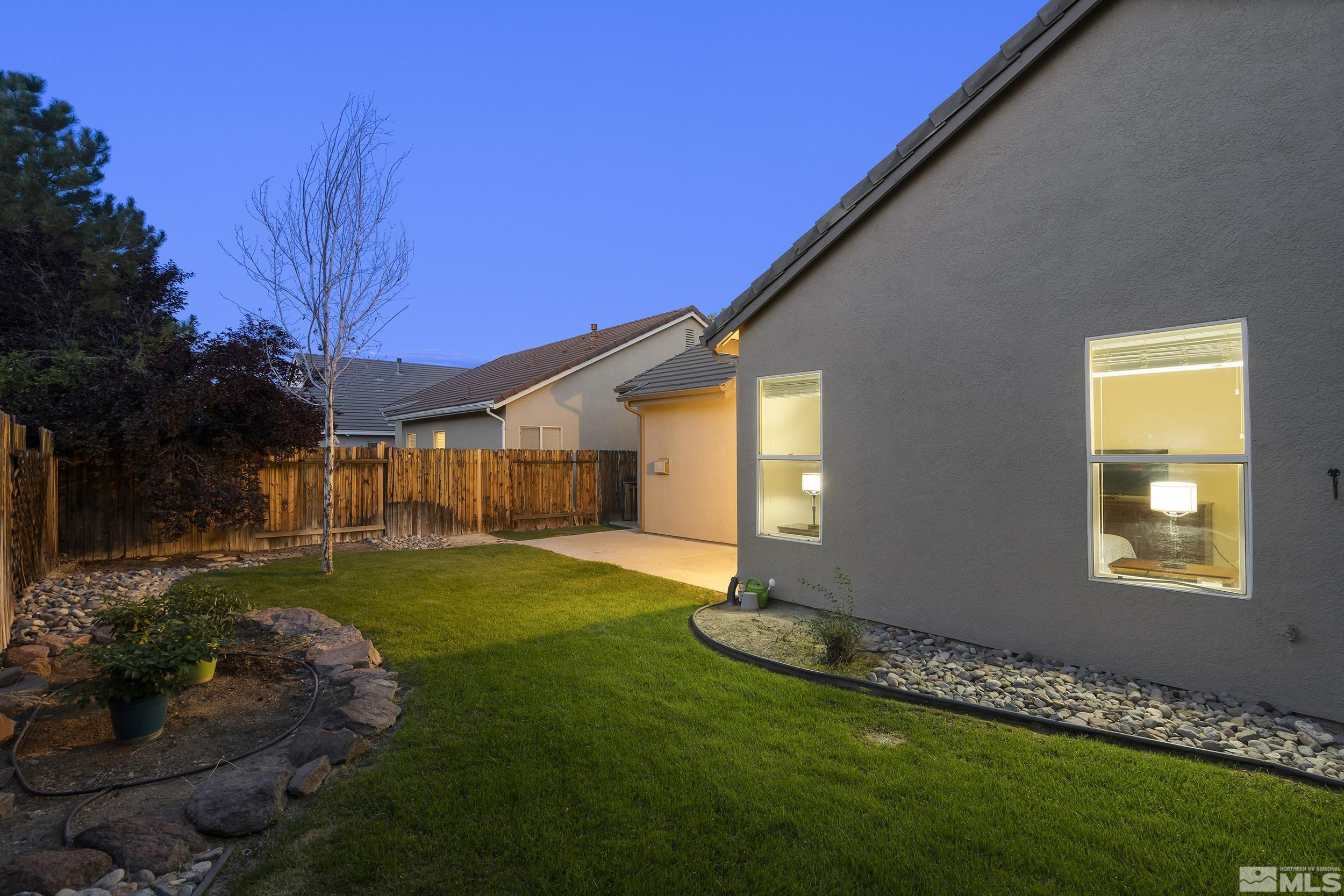 10245 Grizzly Hill Court Reno, NV 89521 - Photo 28 of 40 a front view of a house with garden