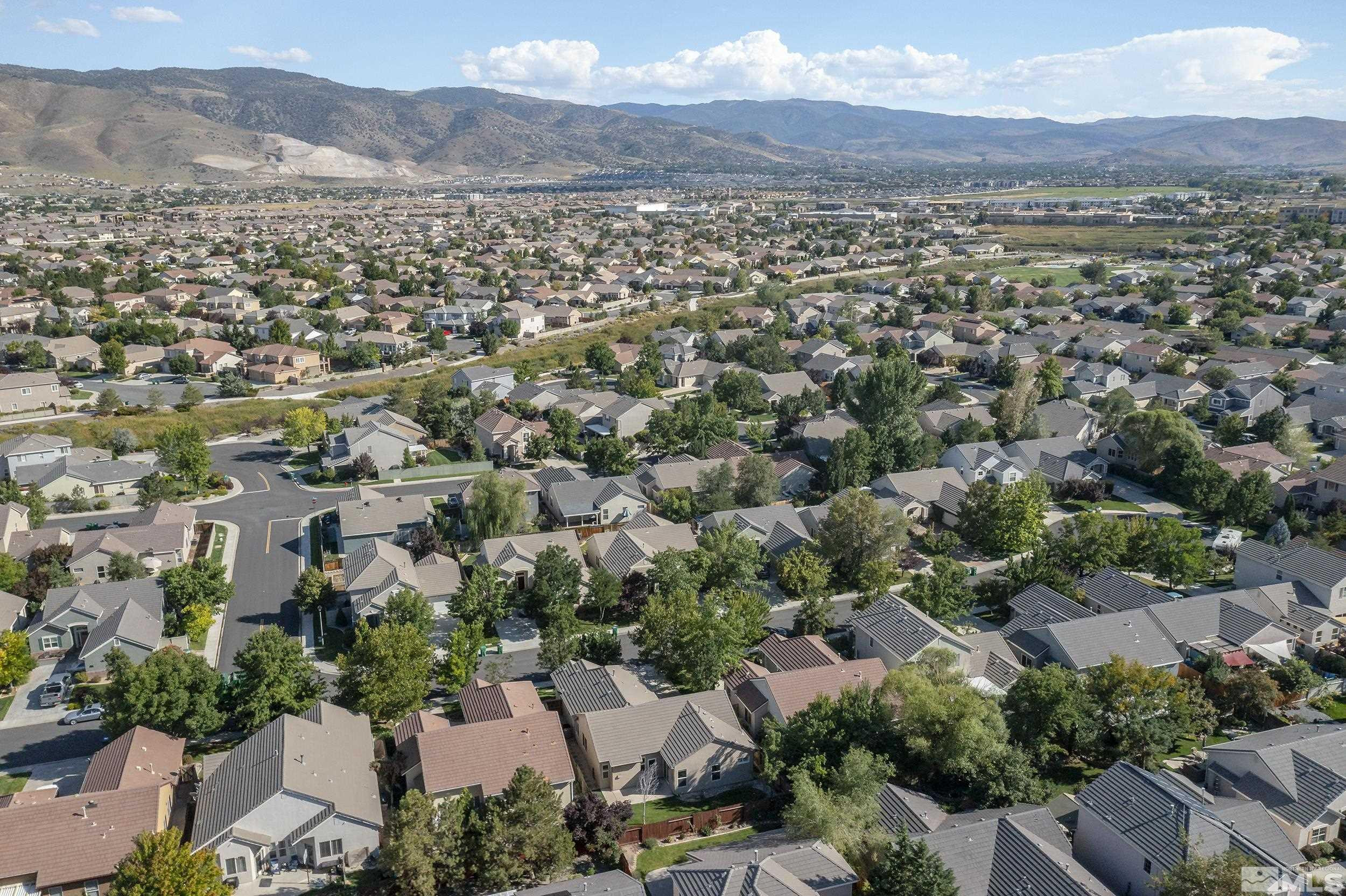 10245 Grizzly Hill Court Reno, NV 89521 - Photo 35 of 40 an aerial view of residential houses with outdoor space and mountain view