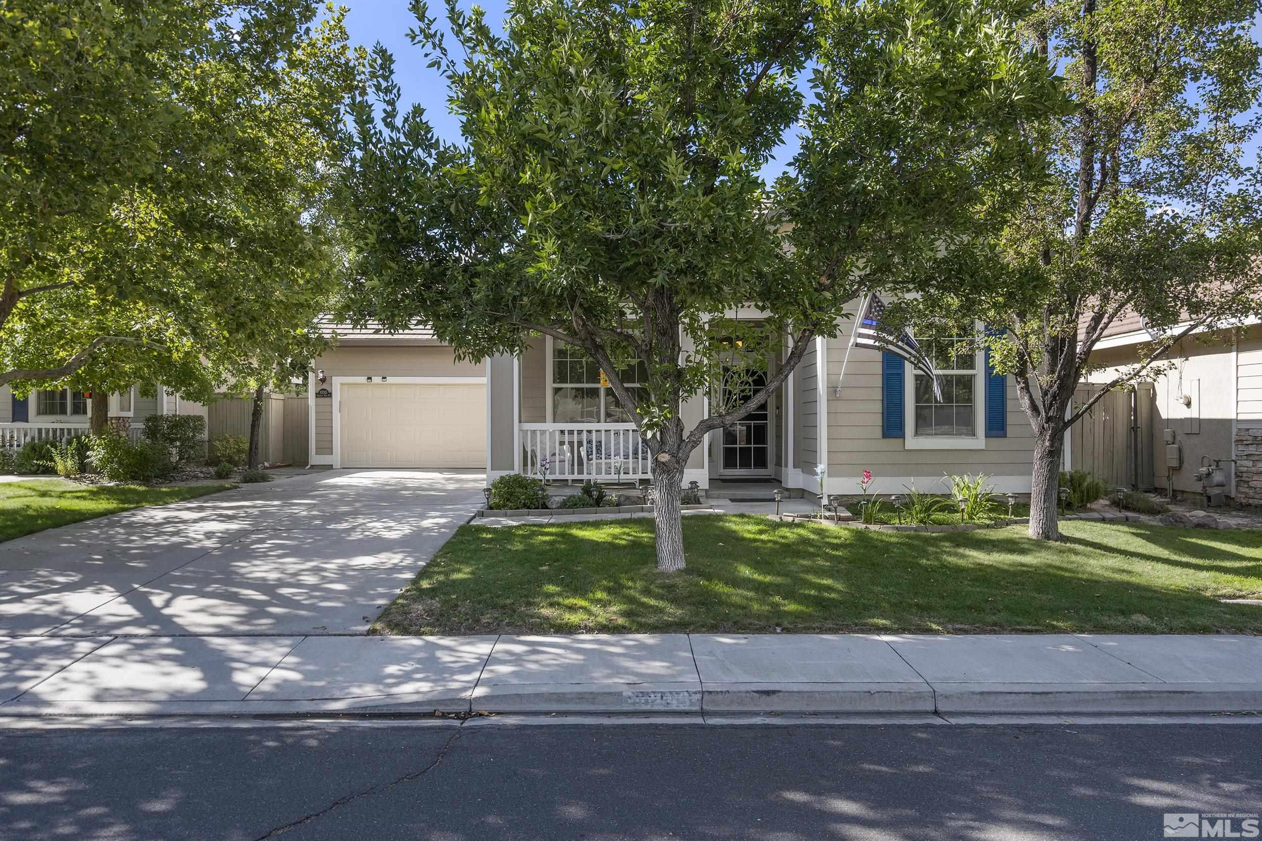 10245 Grizzly Hill Court Reno, NV 89521 - Photo 39 of 40 a front view of a house with a yard
