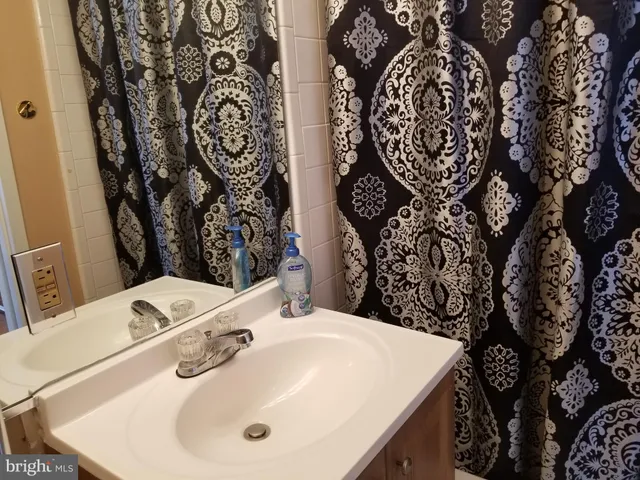 a bathroom with a sink and mirror