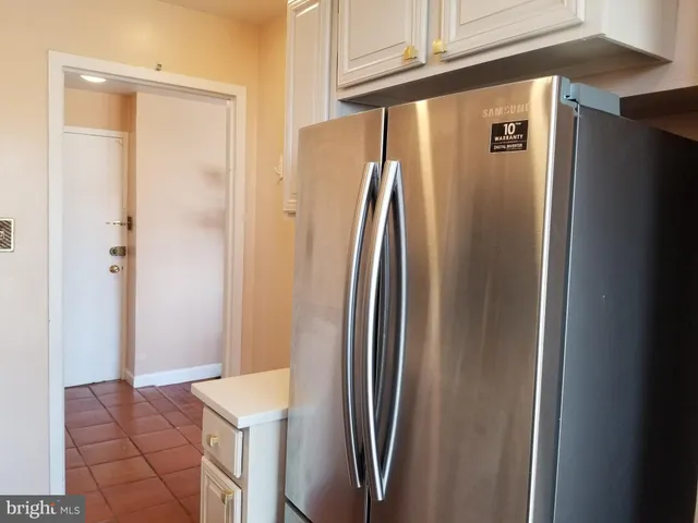 a view of a refrigerator in kitchen