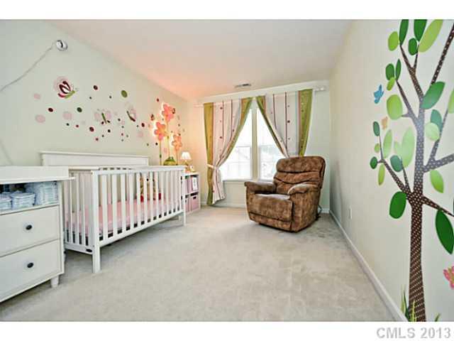 745 Prospect Lane, Unit 745 Fort Mill, SC 29708 - Photo 14 of 16 a bedroom with furniture and a window