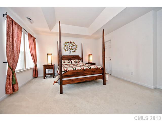 745 Prospect Lane, Unit 745 Fort Mill, SC 29708 - Photo 8 of 16 a bedroom with furniture and a window