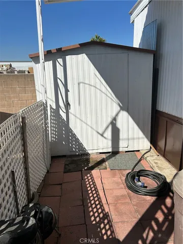 a balcony with table and chairs