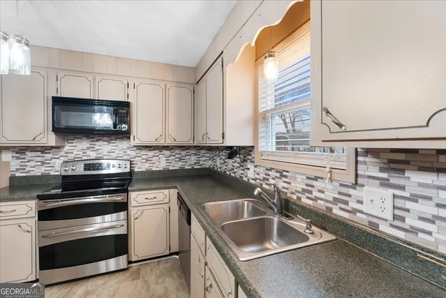 a view of a livingroom with wooden floor and staircase