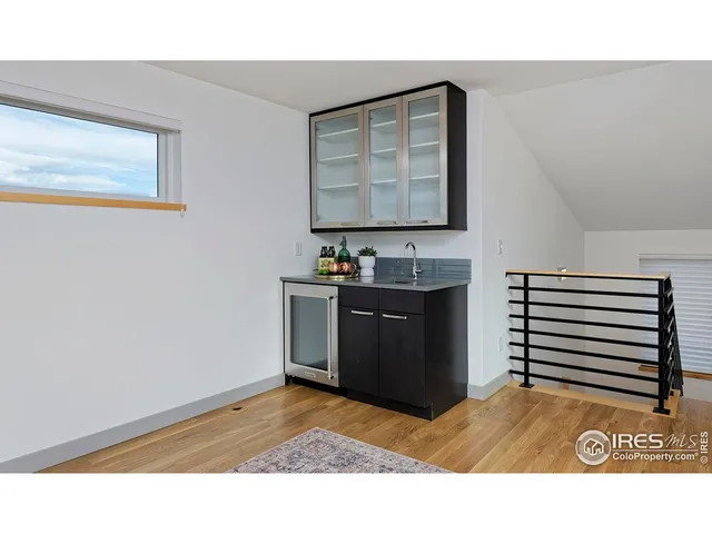 a kitchen with sink and cabinets