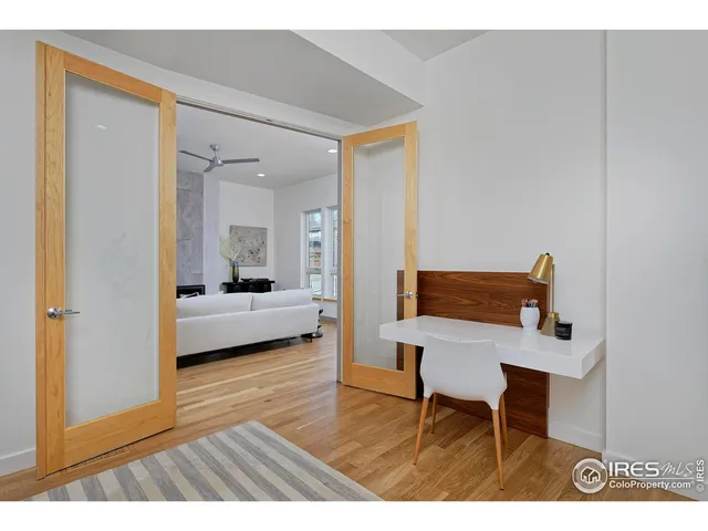 a workspace with furniture and wooden floor