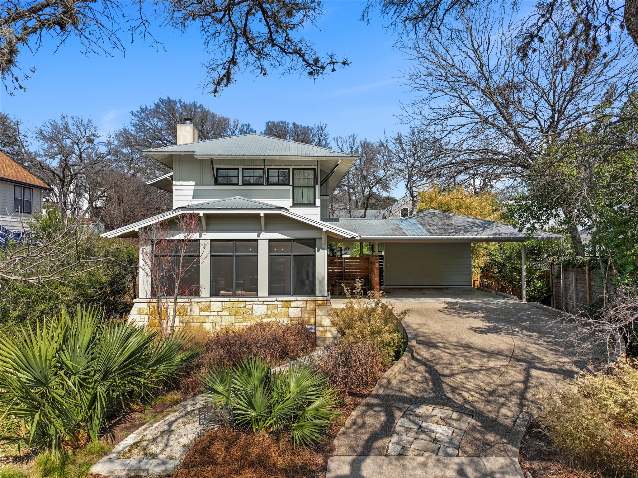 1706 West 10th Street Austin, TX 78703 - Photo 1 of 31 a front view of a house with a yard
