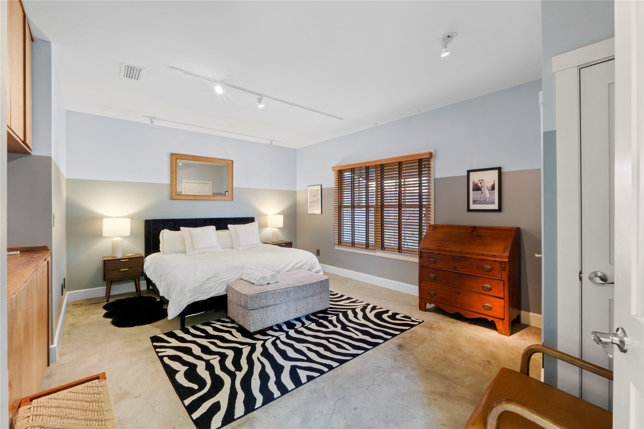 1706 West 10th Street Austin, TX 78703 - Photo 14 of 31 a bedroom with a bed and wooden floor