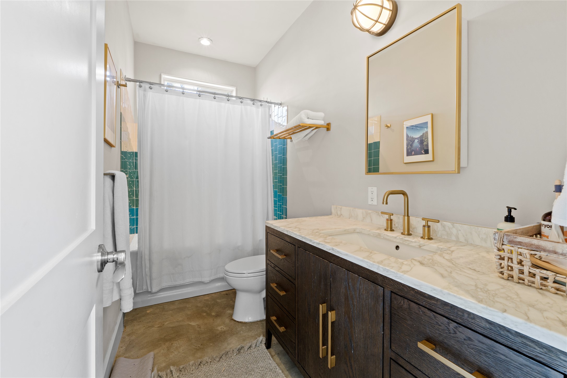 1706 West 10th Street Austin, TX 78703 - Photo 15 of 31 a bathroom with a granite countertop sink mirror vanity and toilet