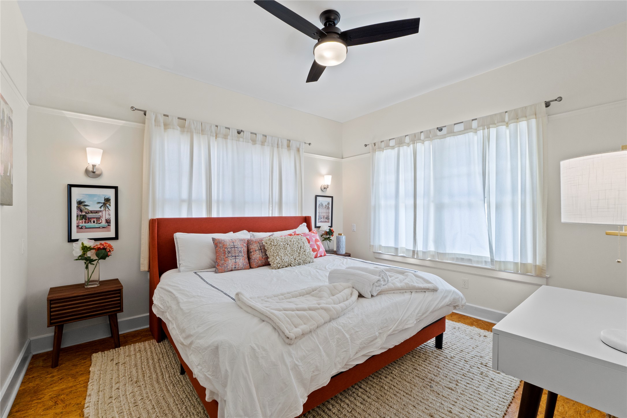 1706 West 10th Street Austin, TX 78703 - Photo 22 of 31 a bedroom with a bed and a chair