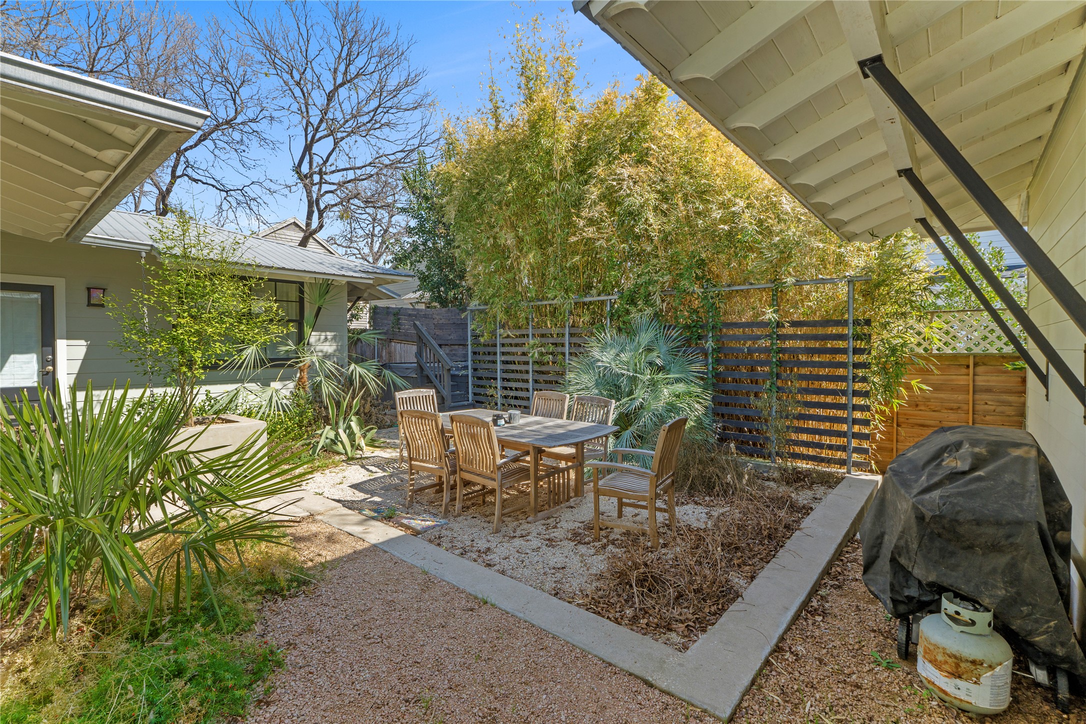 1706 West 10th Street Austin, TX 78703 - Photo 25 of 31 a view of a patio with table and chairs and potted plants