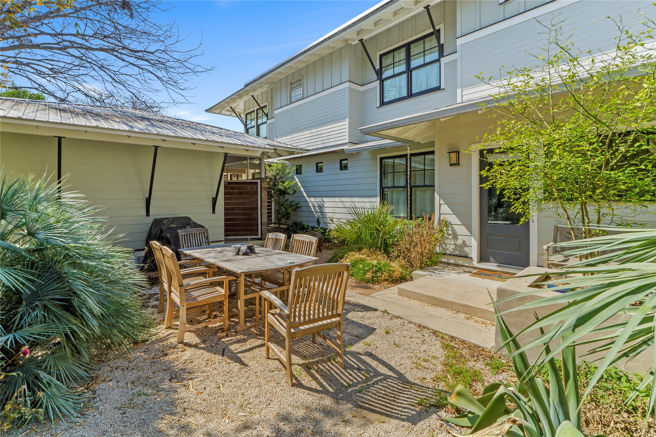 1706 West 10th Street Austin, TX 78703 - Photo 28 of 31 a view of a patio with table and chairs and potted plants