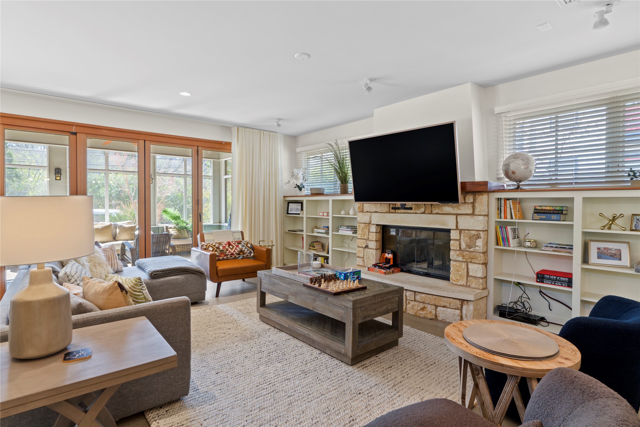 1706 West 10th Street Austin, TX 78703 - Photo 5 of 31 a living room with fireplace furniture and a flat screen tv