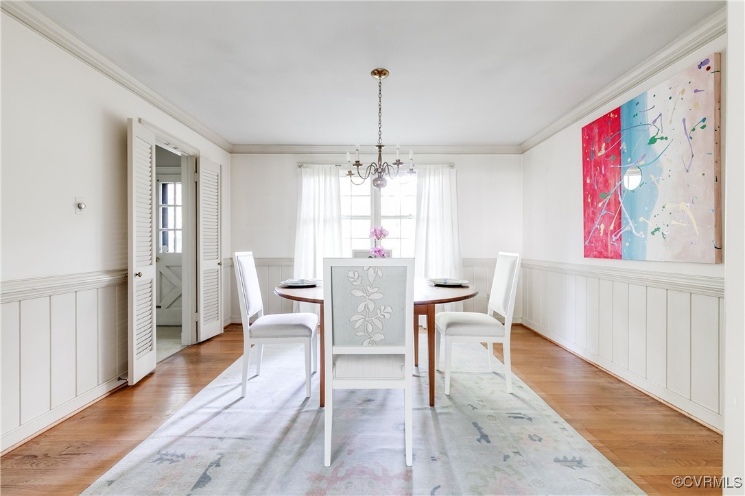201 Wood Road Henrico, VA 23229 - Photo 11 of 40 a dining room with furniture window and wooden floor