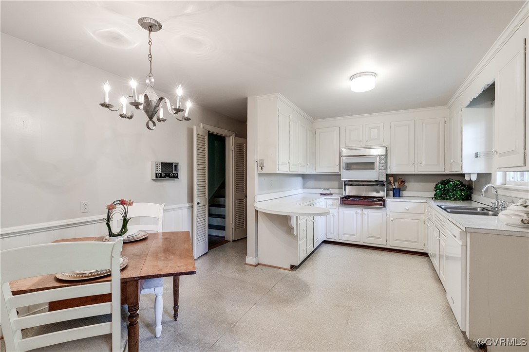 201 Wood Road Henrico, VA 23229 - Photo 14 of 40 a kitchen that has a lot of cabinets and refrigerator