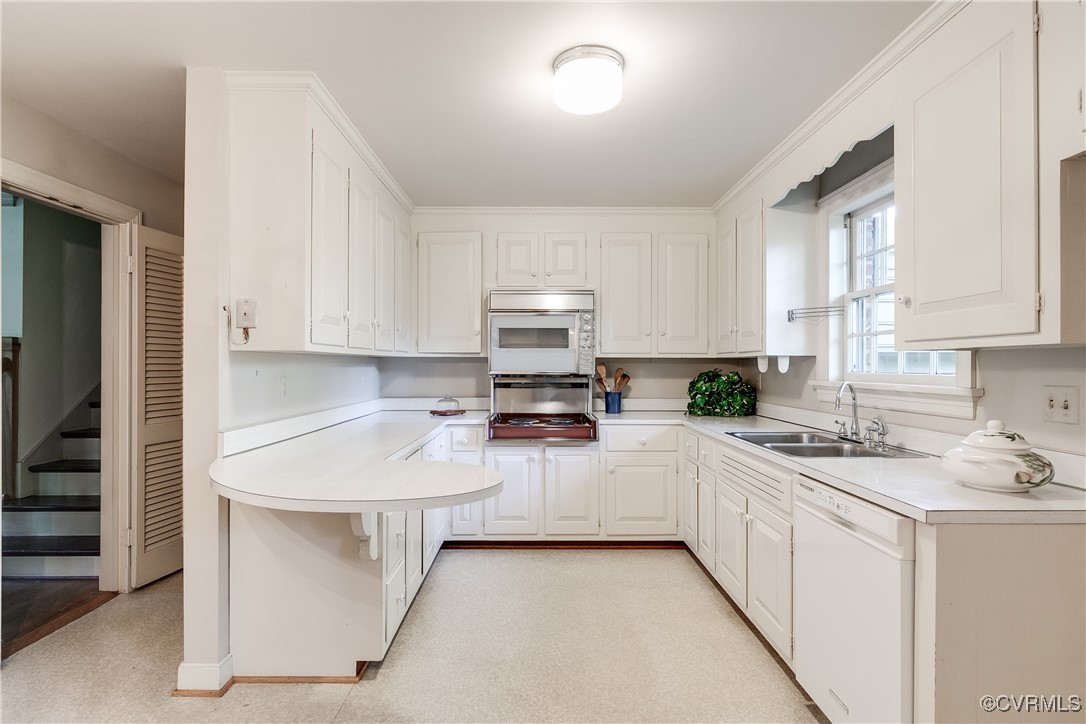 201 Wood Road Henrico, VA 23229 - Photo 15 of 40 a kitchen with appliances a sink and cabinets