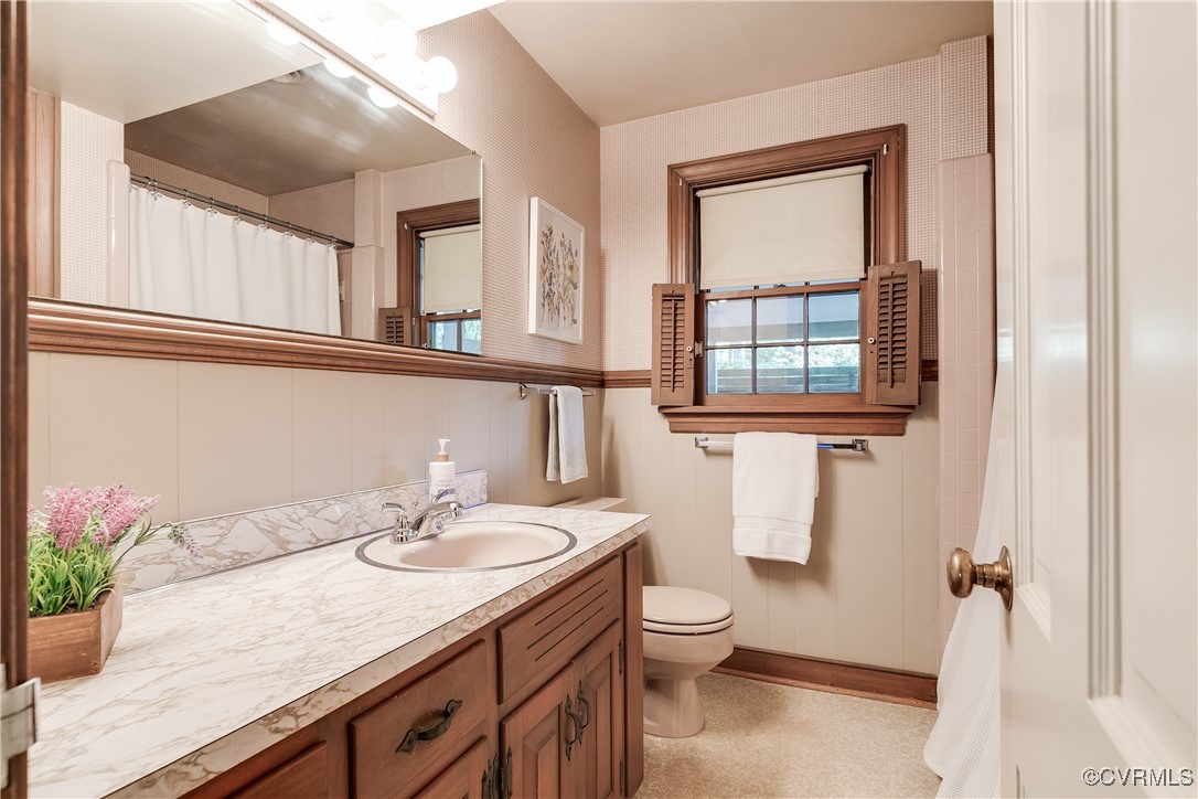 201 Wood Road Henrico, VA 23229 - Photo 20 of 40 a bathroom with a granite countertop sink mirror and a toilet