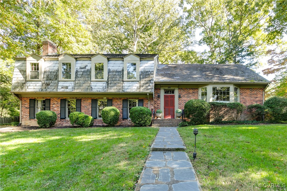 201 Wood Road Henrico, VA 23229 - Photo 2 of 40 a front view of a house with a yard and potted plants