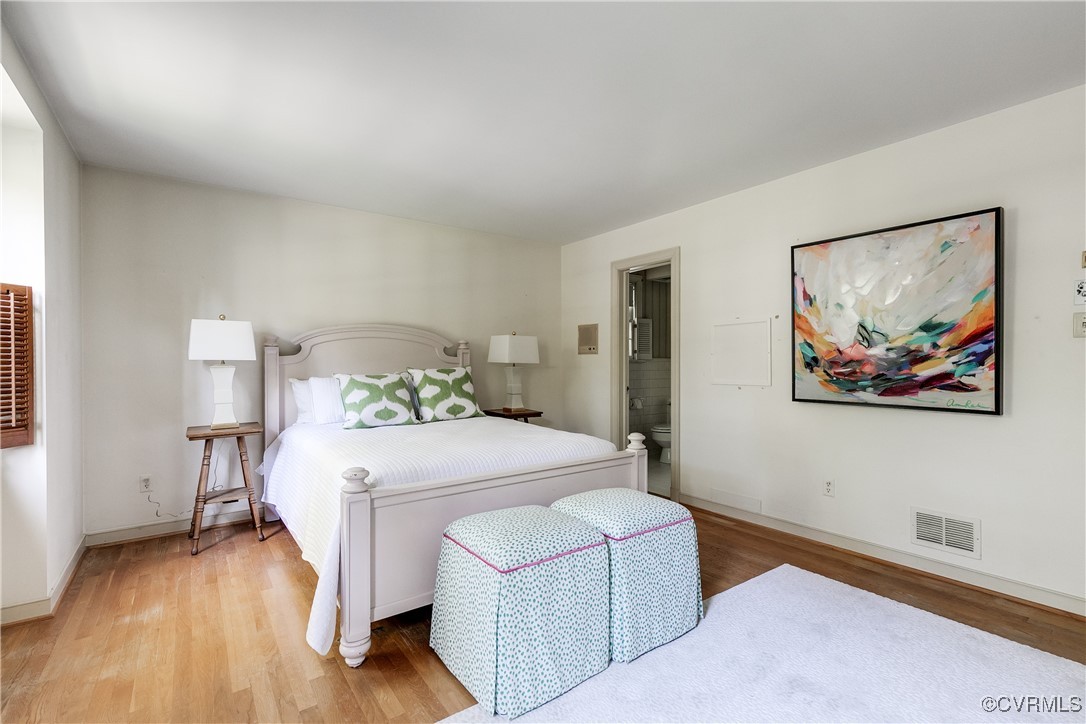 201 Wood Road Henrico, VA 23229 - Photo 28 of 40 a bedroom with a bed and a painting on the wall