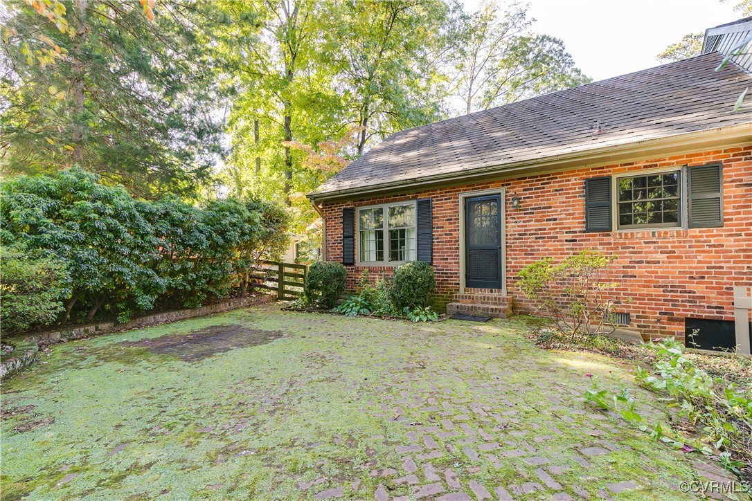 201 Wood Road Henrico, VA 23229 - Photo 35 of 40 a view of a backyard with plants and large tree