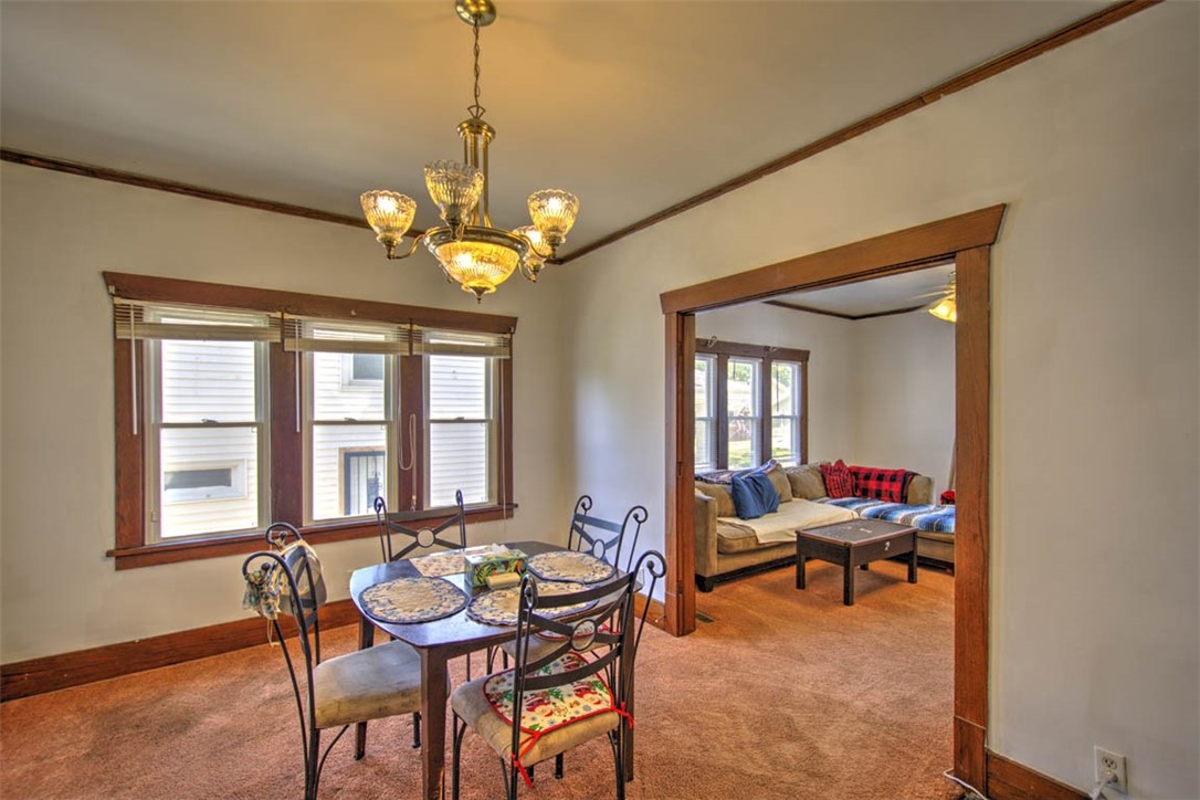 739 West Cushing Street Decatur, IL 62526 - Photo 12 of 28 a dining room with furniture a livingroom and chandelier