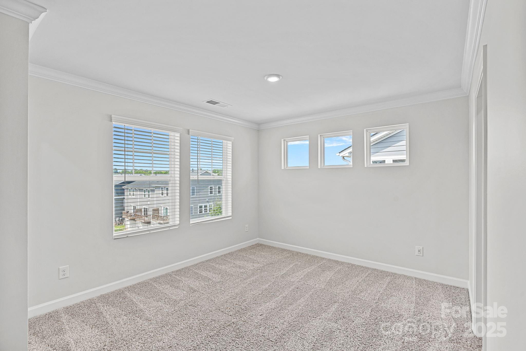 2426 Arbor Loop Drive Charlotte, NC 28217 - Photo 16 of 23 a view of an empty room with a window