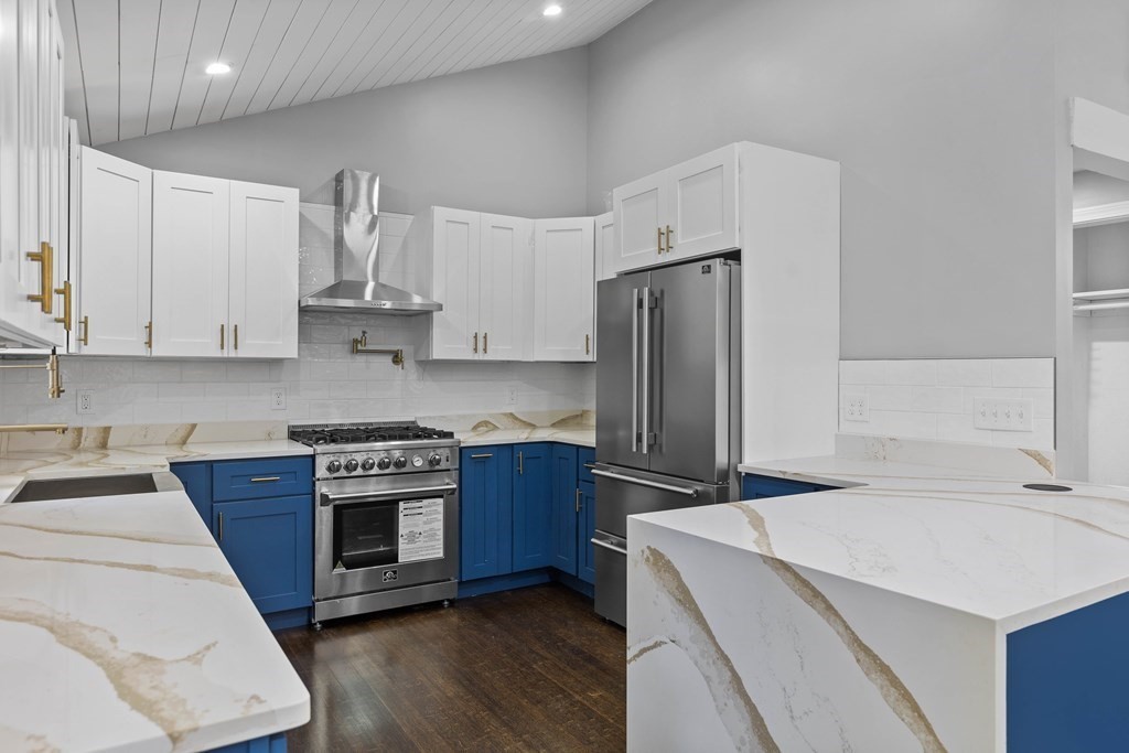 8 Edgewater Drive Dover, MA 02030 - Photo 3 of 31 a kitchen with stainless steel appliances a sink a stove a refrigerator and cabinets