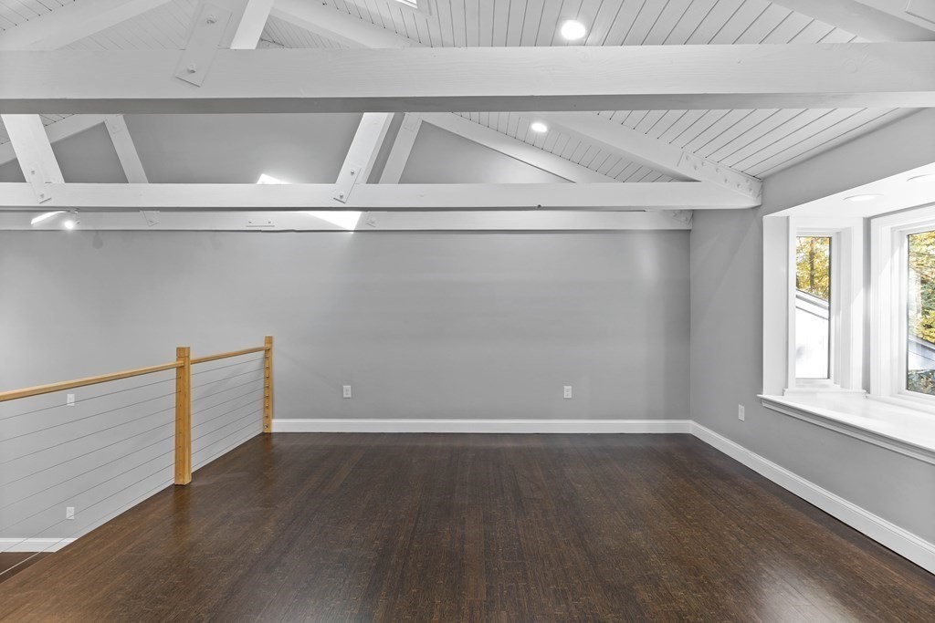 8 Edgewater Drive Dover, MA 02030 - Photo 7 of 31 a view of an empty room with wooden floor and a window