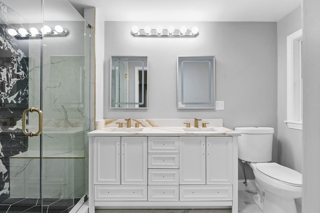 8 Edgewater Drive Dover, MA 02030 - Photo 10 of 31 a bathroom with a toilet a sink and mirror