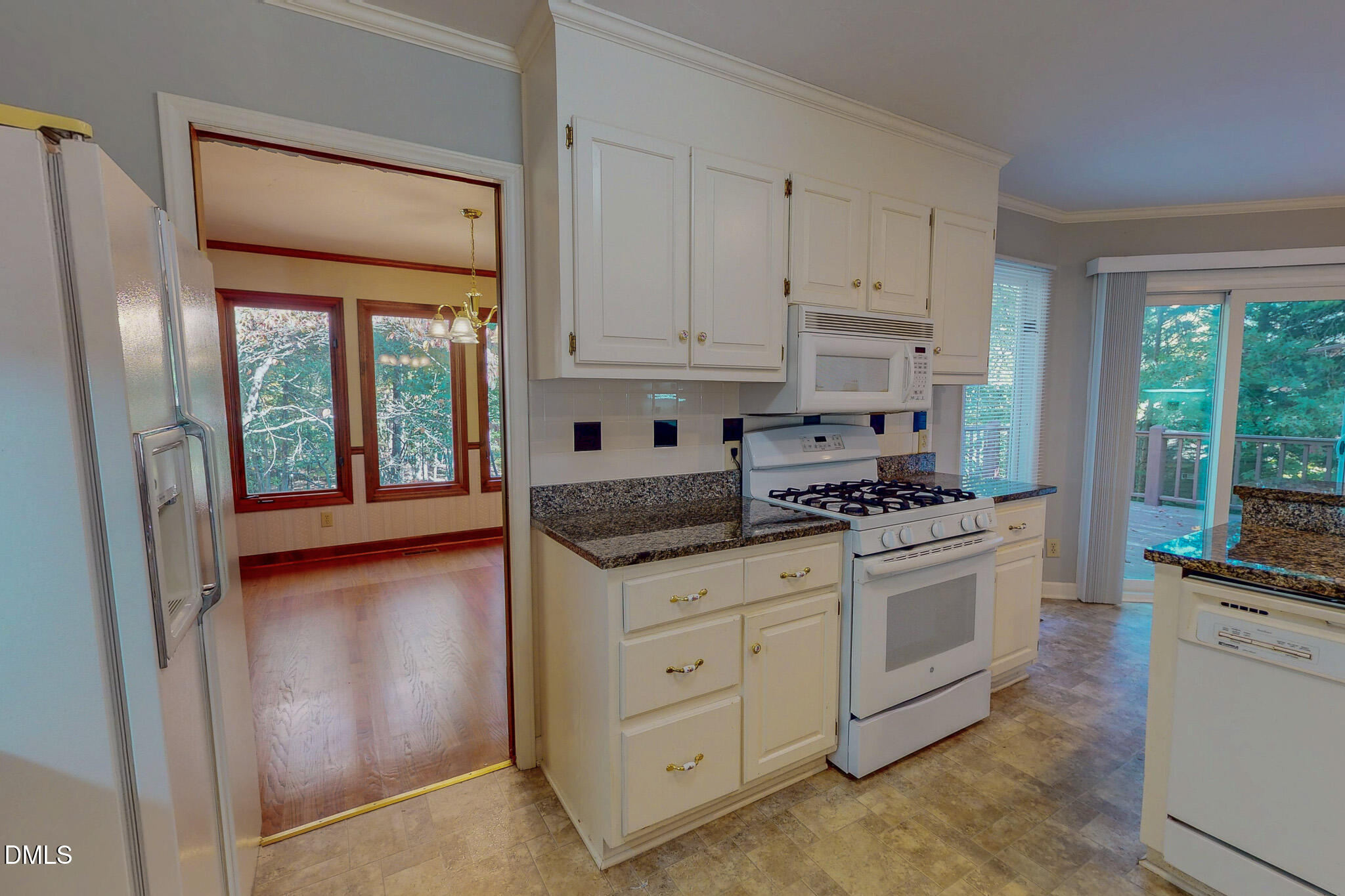 11 Denada Path Roxboro, NC 27574 - Photo 47 of 62 a kitchen with stainless steel appliances granite countertop a stove a refrigerator and a stove