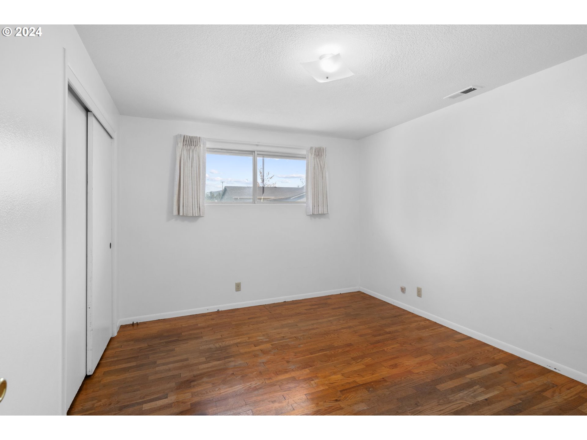 5246 E Street Springfield, OR 97478 - Photo 13 of 26 a view of empty room with wooden floor