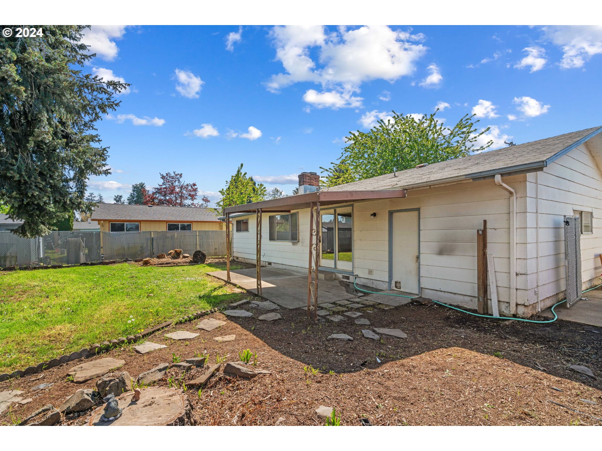 5246 E Street Springfield, OR 97478 - Photo 23 of 26 a view of a house with a yard