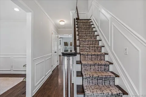 a view of entryway with wooden floor
