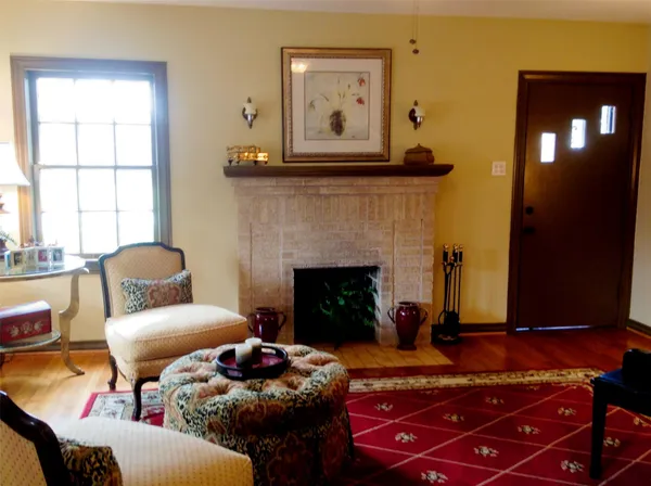 a living room with furniture and a fireplace
