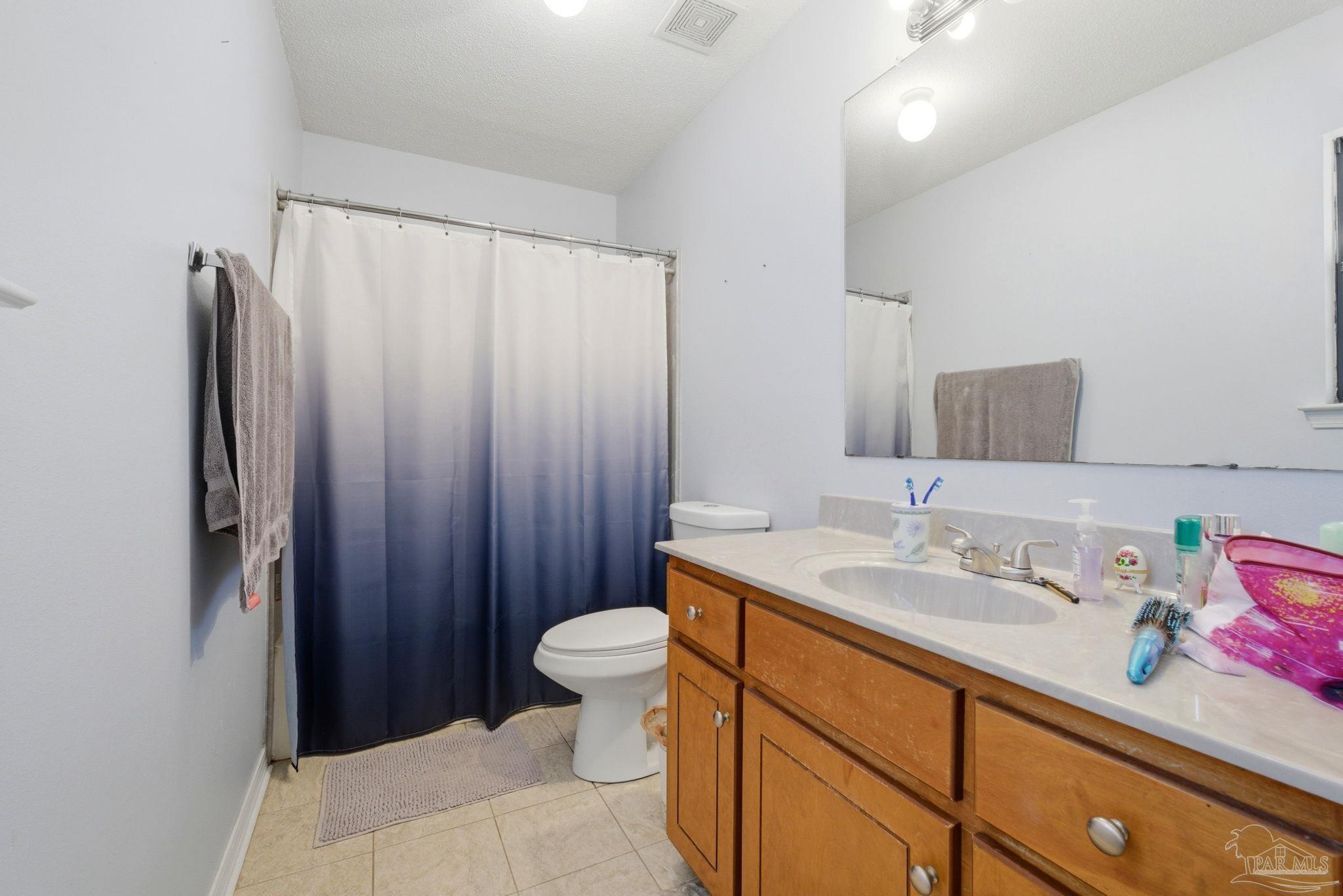 5121 Keyser Mill Road Baker, FL 32531 - Photo 20 of 52 a bathroom with a sink and a mirror