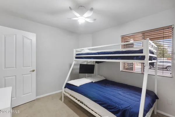 a room with a bed and a chandelier