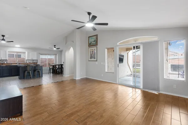 a view of a livingroom with furniture wooden floor and a window