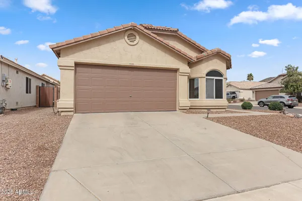 a front view of a house with a outdoor space