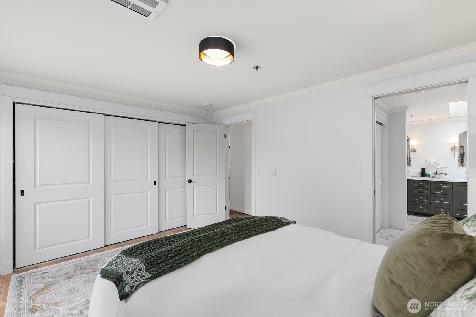 609 7th Avenue North, Unit B304 Edmonds, WA 98020 - Photo 11 of 26 a bedroom with a bed and a couch