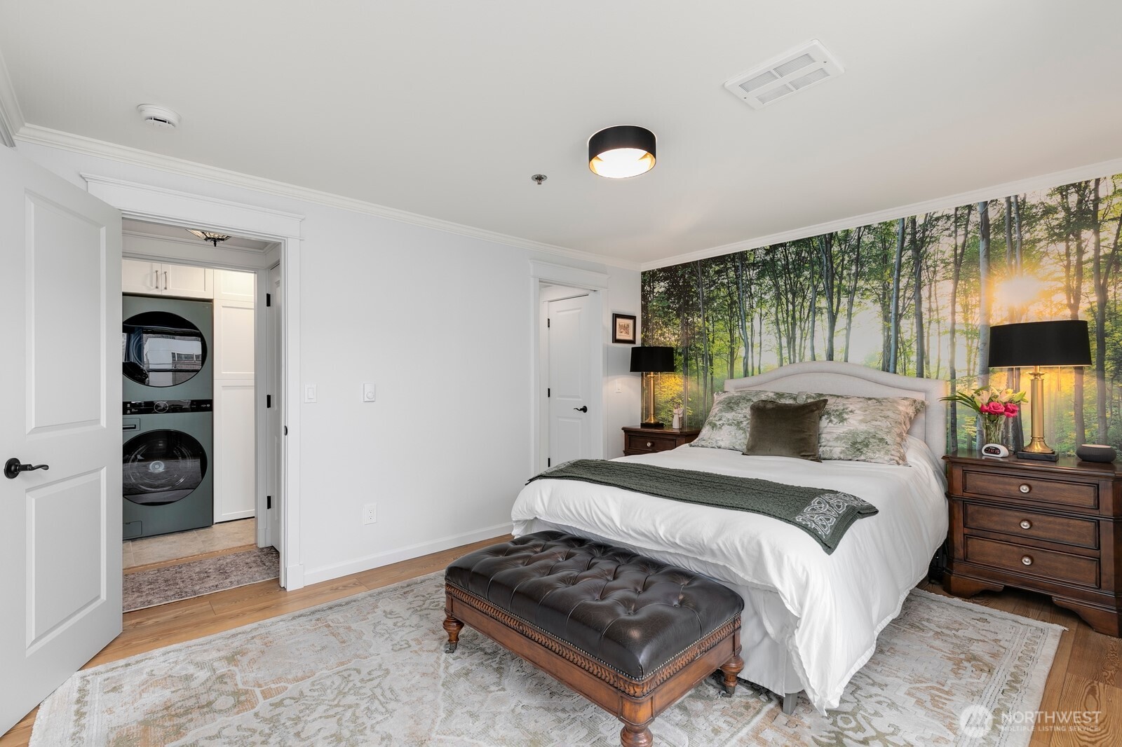 609 7th Avenue North, Unit B304 Edmonds, WA 98020 - Photo 12 of 26 a bedroom with a bed and a television