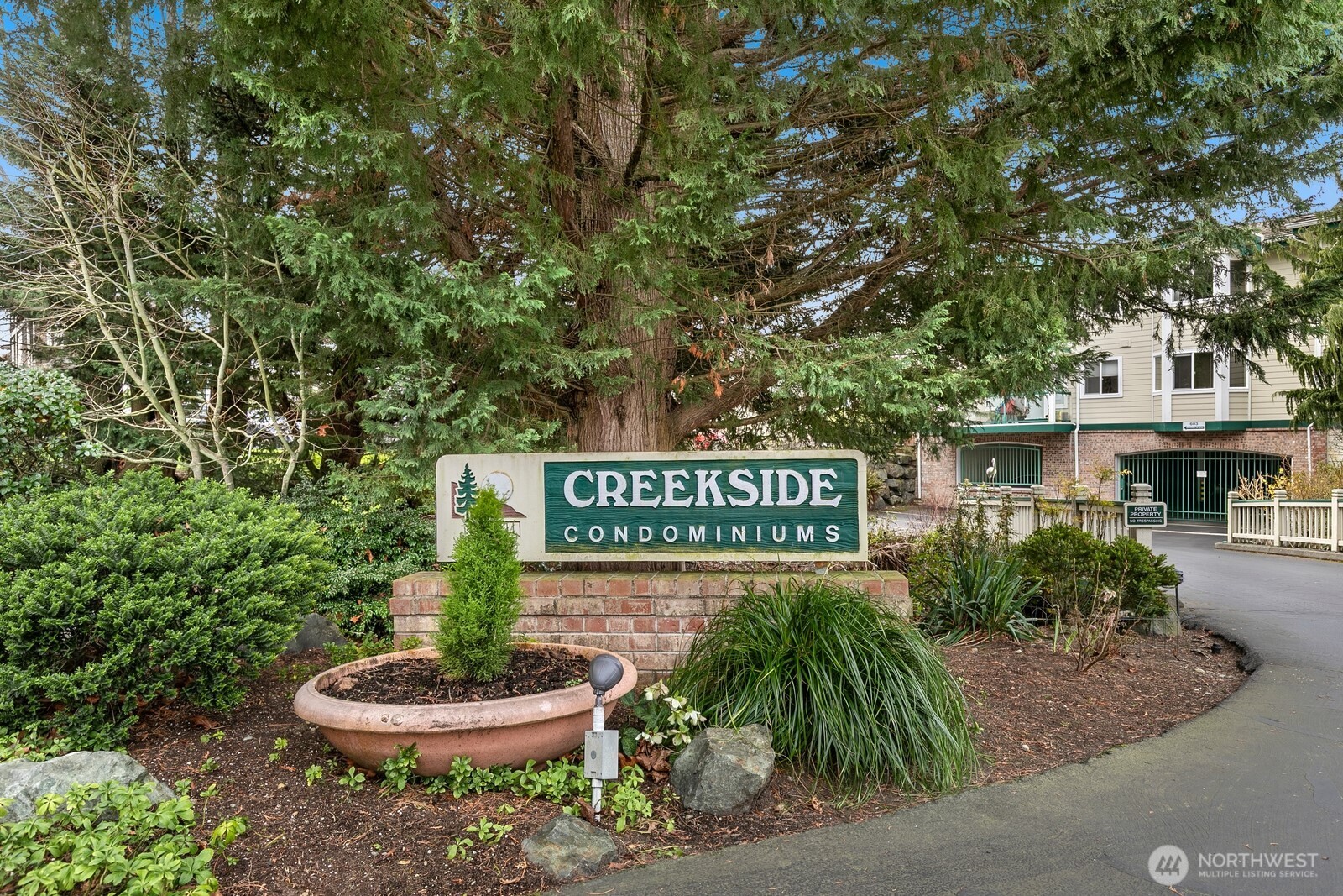 609 7th Avenue North, Unit B304 Edmonds, WA 98020 - Photo 22 of 26 a sign that is sitting in front of a building
