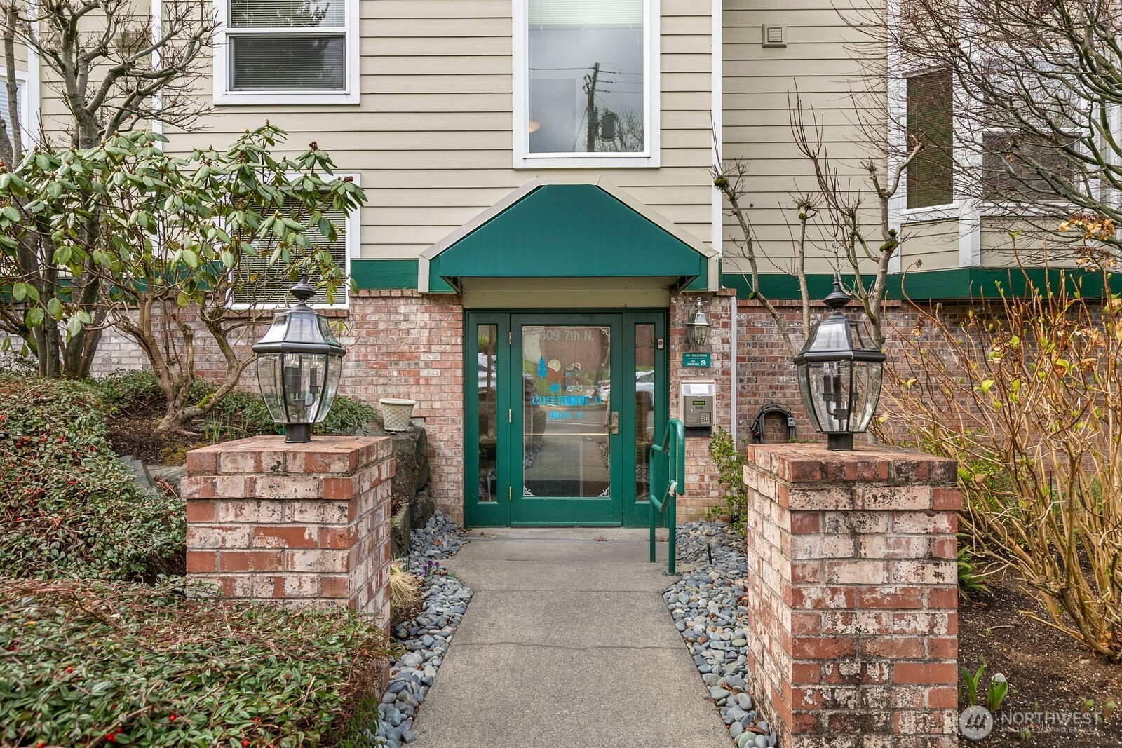 609 7th Avenue North, Unit B304 Edmonds, WA 98020 - Photo 23 of 26 a front view of a house with garden