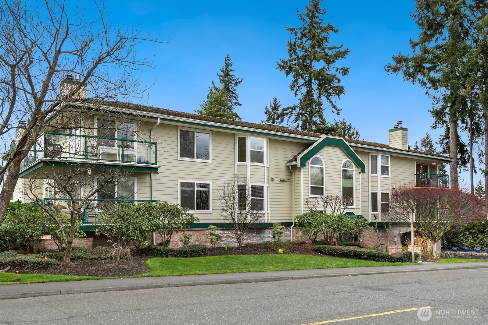 609 7th Avenue North, Unit B304 Edmonds, WA 98020 - Photo 26 of 26 a front view of a house with a garden