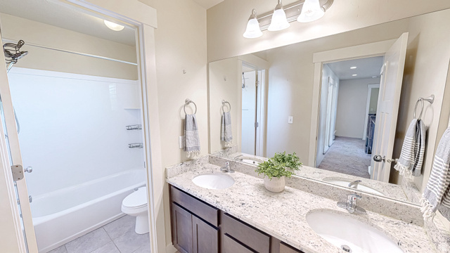 368 East 700 North Springville, UT 84663 - Photo 18 of 55 Full bath with double vanity, shower combination, and light tile patterned floors