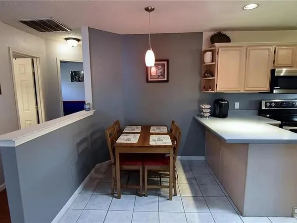 a kitchen with a sink cabinets and window
